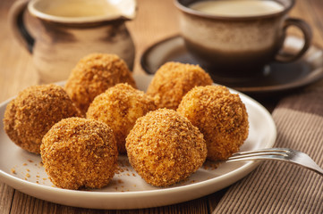 Homemade cottage cheese balls, hungarian sweet dessert served with sweat fraiche creme.