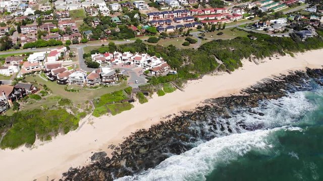 Coastal view of Jeffreys Bay. Aerial dolly backwards