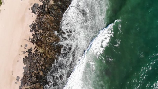 Stunning supertubes scenery in sunny day. Aerial descending, birds eye