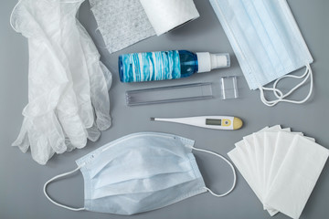 Protection from viral infections, transmitted by airborne droplets. Medical mask, a bottle of...