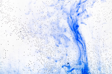 air bubbles on glass and blue ink flowing