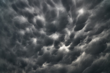 Stormy sky with dark angry clouds; photo.