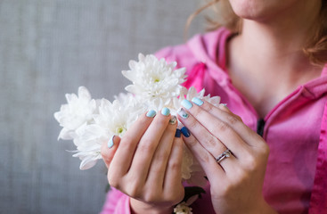 Beautiful manicure on the girl 's hands. Spring manicure.