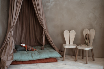 interior of the children's room. light cute with a canopy.