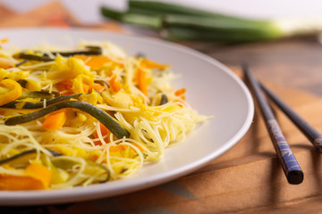 Rice noodles with vegetables. Traditional Asian dish