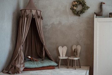 interior of the children's room. light cute with a canopy.