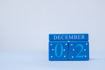 A seasonal clean scene in blue and red with calendar blocks for 2 December date