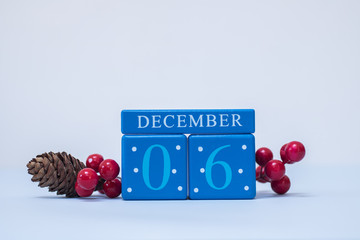 A festive clean Christmas-themed scene with calendar blocks for 6 December date