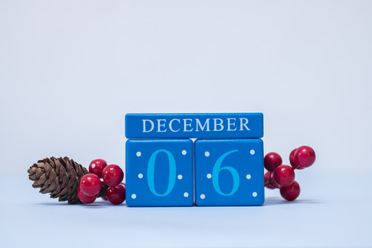A festive clean Christmas-themed scene with calendar blocks for 6 December date