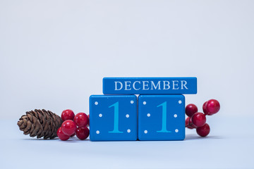 A seasonal clean Christmas-themed scene in blue and red with calendar blocks for 11 December date