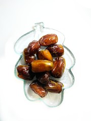 date palm on a plate isolated on white background