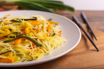 Rice noodles with vegetables. Traditional Asian dish