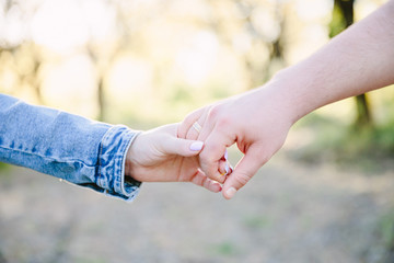 Couple Wife Husband Dating Relaxation Love Concept. Couple hands together touch with love. People, family, care and support concept - close up of young  woman and man holding hands together