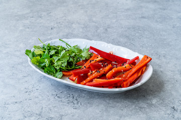 Antioxidant Salad Julienne Sliced Red Bell Pepper Slices and Parsley with Sesame Seeds and Olive Oil.