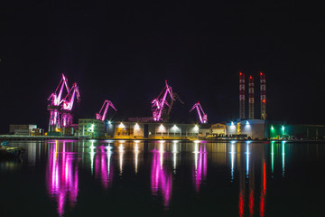 Lighting Giants - colorful illuminated cranes at night in Pula, Istrian Peninsula in Croatia