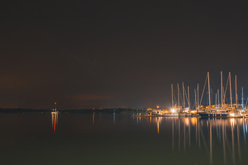 Fototapeta na wymiar boats at harbour at night in Pula, Istrian Peninsula in Croatia