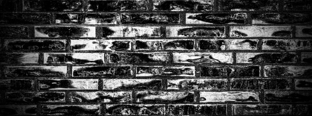 black brick wall of dark stone texture. Black color brick wall background.