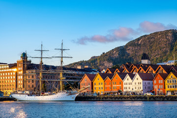 Bergen, Norway - Panoramic view of historic Bryggen district at the Bergen harbor with Floyen Mountain in background - 343046221