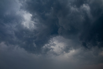 Naklejka na ściany i meble Light in the Dark and Dramatic Storm Clouds background,before the rain