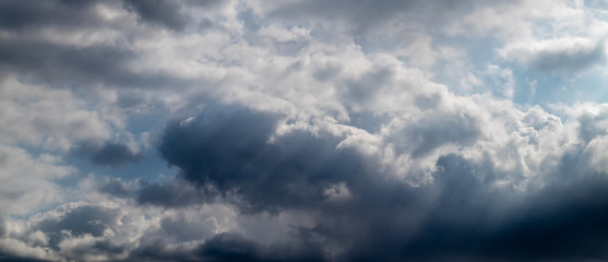 Obraz premium Light in the Dark and Dramatic Storm Clouds background,before the rain