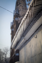 Fototapeta premium icicles hanging from the roof