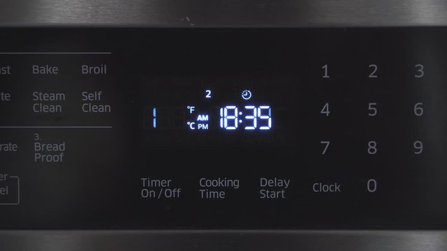 Close up of oven display flickering, control panel blinking. Electricity problem