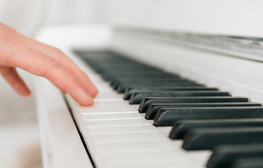 Close up white piano keyboard. Music instrument. Black and white key. Play sound, chord, melody....