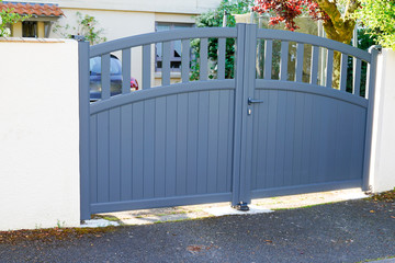 modern grey gate aluminum home portal with blades suburbs house street