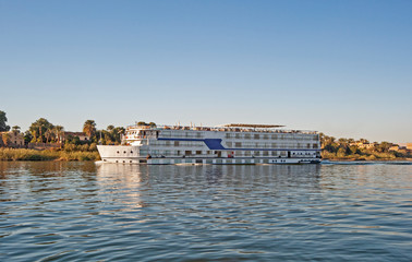 Fototapeta na wymiar Large egyptian river cruise boat sailing on Nile