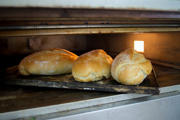 Three loaves of bread in the baking oven
