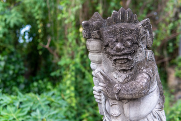 Hindu statue and trees in background