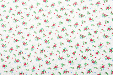 Beautiful calico texture with embroidered flowers on a calm plain background