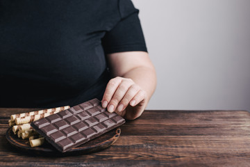 Emotional eating mental disorder, depression, loneliness, stress. Lonely woman eating sweets. Nerve...