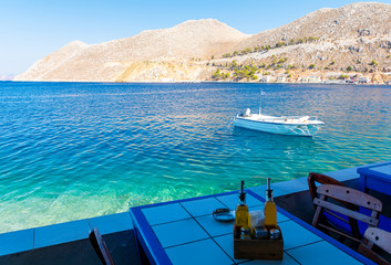 view from tavern on beautiful azure sea on Symi island greece
