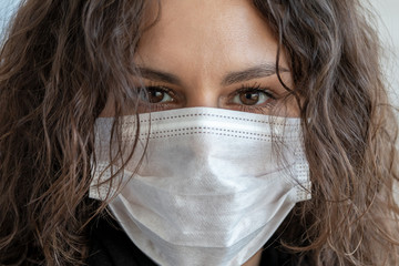 Girl in medical mask protecting against coronovirus