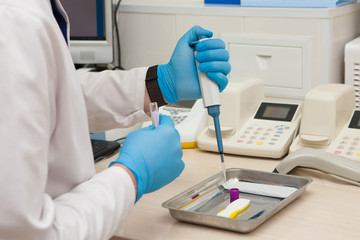 Conducting tests in a medical laboratory.