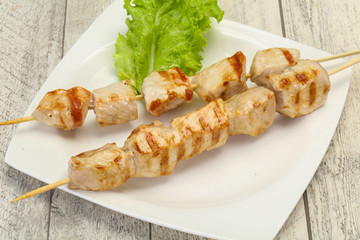 Grilled pork skewer served salad
