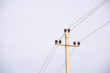 Minimalist photo with a pole on a background of gray-blue sky in the evening in summer
