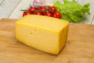 Hard yellow tasty cheese brick