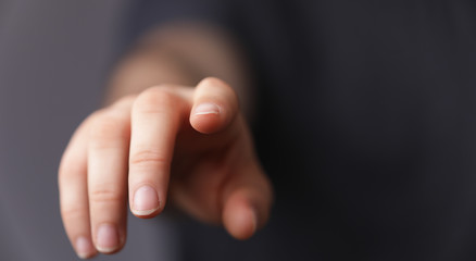 Naklejka premium A man hand touching virtual screen, modern background concept , can put your text at the finger, copy space.