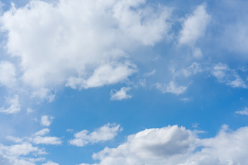 Naklejka na ściany i meble Blue sky texture with white clouds