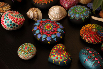 Composition of shells and painted rock mandala