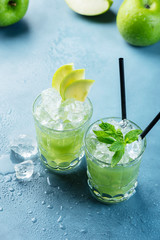 Green cocktail with ice and mint