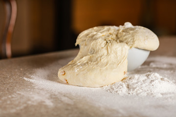 Fresh bread dough on white  kitchen table