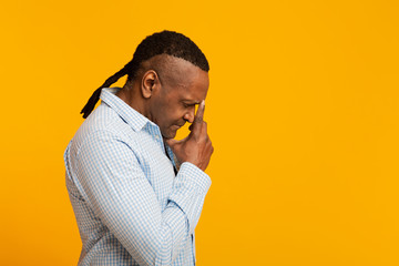 Pensive mature african american man deep in thoughts