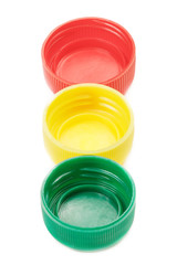 Colorful plastic bottle caps isolated on white background