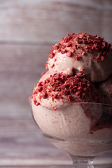 Strawberry ice cream in a flask on a light background