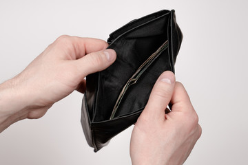 hands holding a wallet, opened a wallet