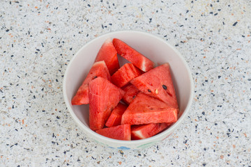 sliced fruit on bowl, red watermalon.