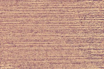 Background of an old worn carpet, texture with a brown pattern